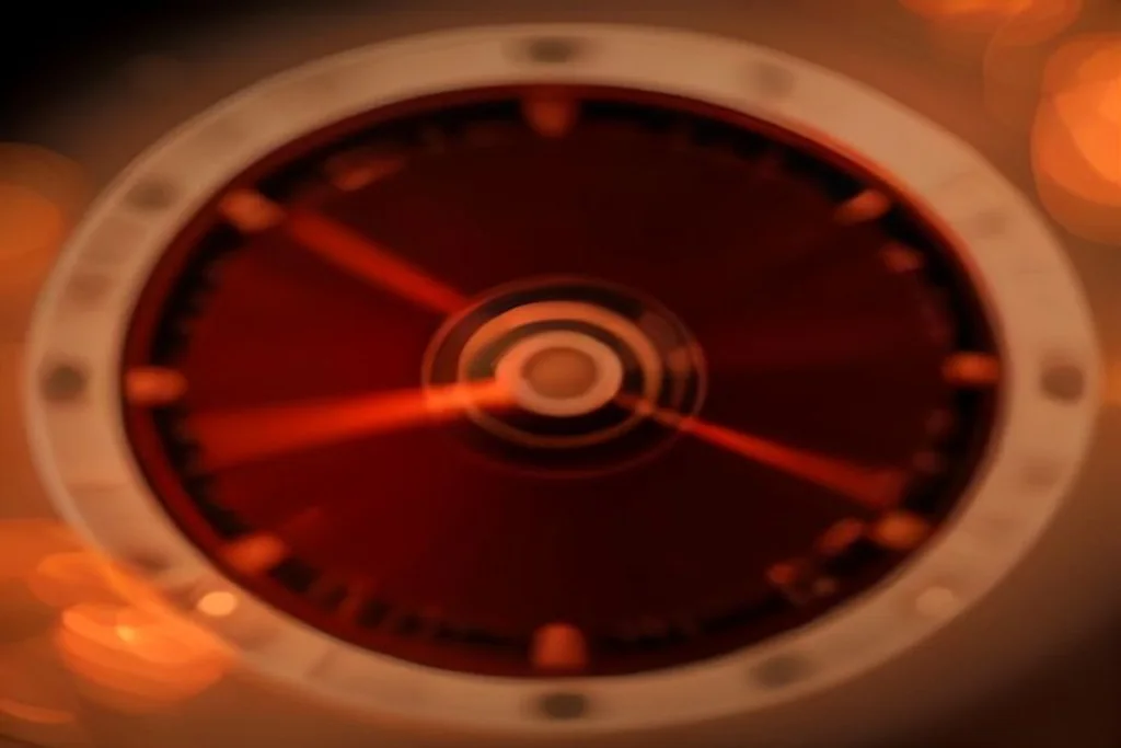 Roulette wheel with chips in soft bokeh, no readable numbers
